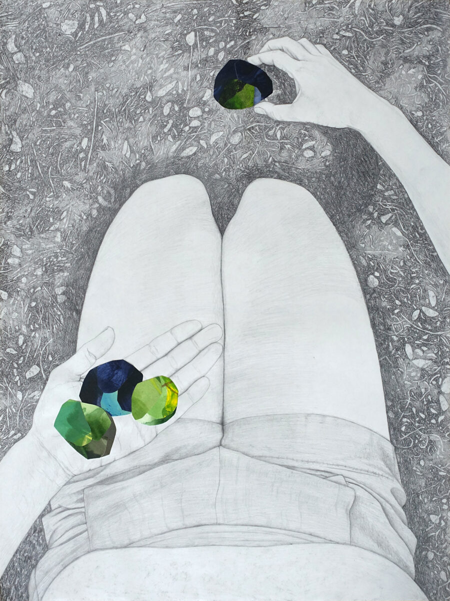 Graphite drawing from the perspective of a woman kneeling; in one hand she hold three colorful objects that are collaged onto the drawing, and in the other hand she is picking up an object. The objects are shaped like rocks.
