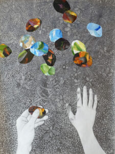 Graphite drawing from the artist's perspective. Only the hands are visible at the bottom of the image. One hand rests on the ground while the other has picked up a colorful, rock-shaped object. More of these objects are spread across the ground.