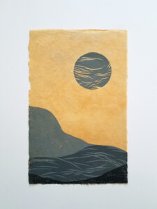 Woodcut print of an abstracted landscape with a moon above. The print is in shades of gray on light orange paper.