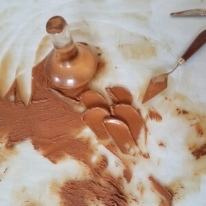 mulling ochre oil paint